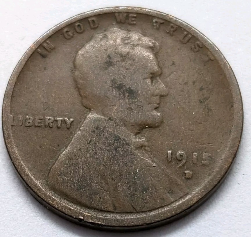 1915 wheat penny lamination error showing peeling or missing metal flap on the coin surface